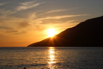 Sunset at the beach with mountain