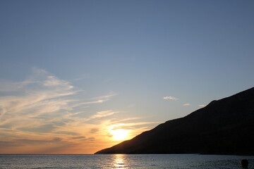 Sunset at the beach with mountain