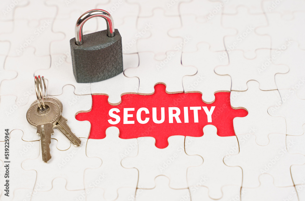 Poster On puzzles there is a lock and keys, on a red surface there is an inscription - security