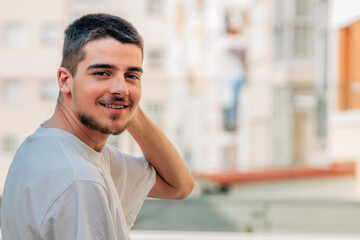 portrait of young boy with beard or goatee in the city outdoors