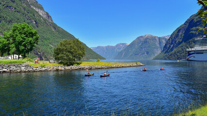 Fototapeta na wymiar Kayaking in beautiful fjord, lake and mountains landscape