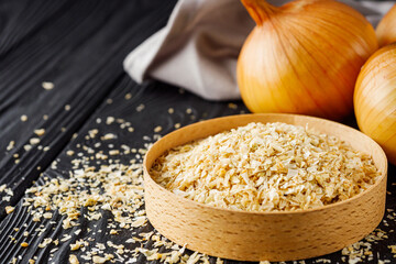 dried onions on a black wooden rustic background