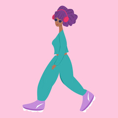 girl walking in sportswear and headphones