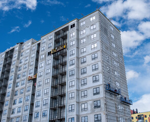 Builders, installers, high-rise workers, industrial climbers, plasterers on the lift, cladding of...