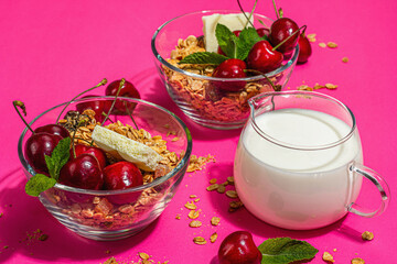 Summer breakfast concept. Healthy morning food. Ripe cherries, milk, white chocolate, and granola