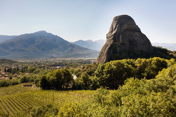 The view on Kalabaka town from miraculous monastery on rock formation, Meteora, Greece, beside the Pindos Mountains.