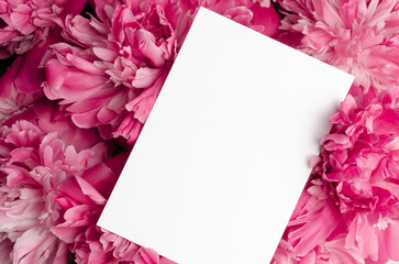 Blank invitation card mockup with pink peony flowers