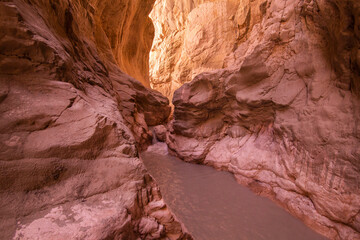 Saklikent Canyon interior view of naturally shaped purple orange rocks and flowing river in the...