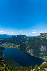 Stunning aerial view of Altaussee lake from Trisselwand with the peak Standling and Loser on a sunny summer day, Salzkammergut-Ausseerland region, Styria, Austria - 519235937