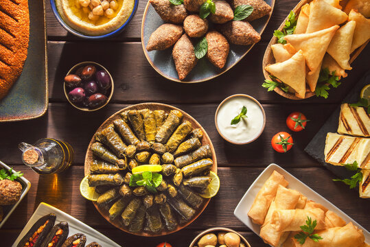 Arabic Cuisine;  Middle Eastern traditional dishes and assorted mezze or meze. Vine leaves, kibbeh, spring rolls, sambusak, kibbeh nayyeh, makdous, haloumi cheese, olives, hummus and yogurt salad.