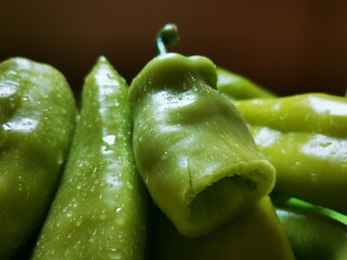 Drops of water on green organic pepper