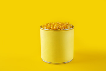 Fresh corn grain on a yellow background