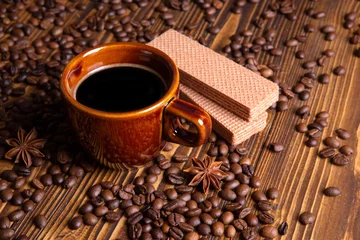 Papier Peint photo Lavable Bar a café ceramic brown cup with black coffee and grains on wooden background still life