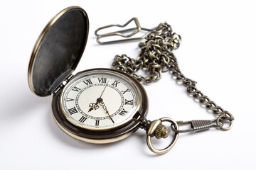 pocket watch on a white table closeup