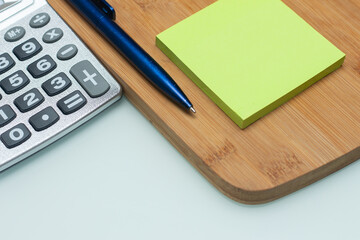 calculator near notepad - office