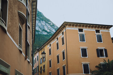  Houses and architecture of the city against the backdrop of mountains. Beauty and vacation, summer day, travel.