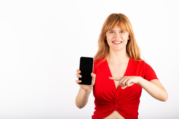 Fototapeta premium Happy young woman showing the phone screen.
