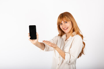 Naklejka premium Young businesswoman portrait with smartphone in studio.