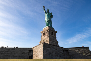 Fototapeta premium Statue of Liberty standing on base