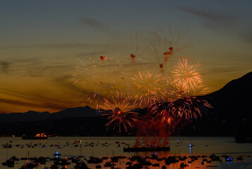 Sunset Fireworks over English Bay Vancouver. Summer fireworks display over English Bay, Vancouver,...