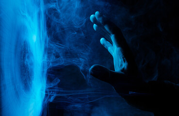 Crystal sphere with mystical smoke in hands. Mysterious composition. Fortune teller, mind power,...