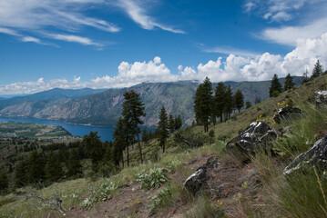 Fototapeta na wymiar View of Lake Chelan Washington, dark clouds covering mountain top