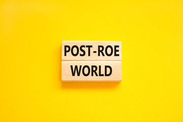Roe vs Wade post-Roe world symbol. Concept words Post-Roe world on wooden blocks on a beautiful yellow table yellow background. Business and Roe vs Wade post-Roe world concept. Copy space.
