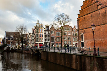 Traditional Amsterdam street view with Dutch houses and bicycles, Amsterdam downtown, Netherlands