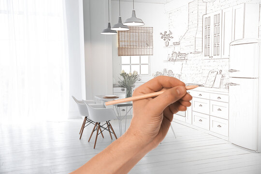 Woman drawing kitchen interior design, closeup. Combination of photo and sketch