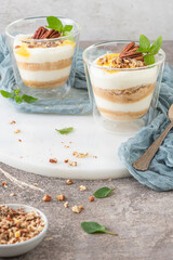 Natas do Ceu is a traditional Portuguese dessert made with cream, eggs and biscuits decorated with pecan nuts and mint leaves