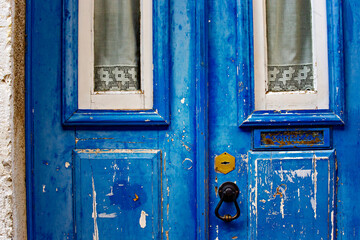 Beautiful old wooden blue door in traditional Lisbon house, Portugal
