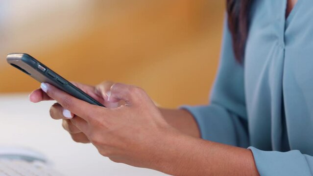 Trendy woman texting a message on social media using her phone. Closeup of a modern girl writing and sending text on an instant messaging chat app. Person typing content to post or share online