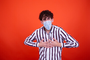 Illness and cold. Handsome guy and orange background.	