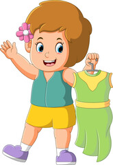 The girl is holding a beautiful dress and ready to wear