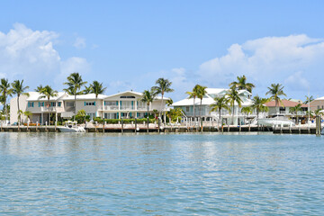 Waterfront homes and boats along the waterway in Marathon key in the Florida Keys - obrazy, fototapety, plakaty