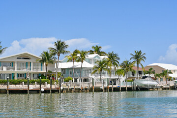 Waterfront homes and boats along the waterway in Marathon key in the Florida Keys - obrazy, fototapety, plakaty
