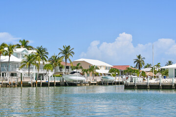 Fototapeta na wymiar Waterfront homes and boats along the waterway in Marathon key in the Florida Keys