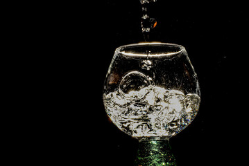 Obraz na płótnie Canvas cocktail wine glass with bubbles