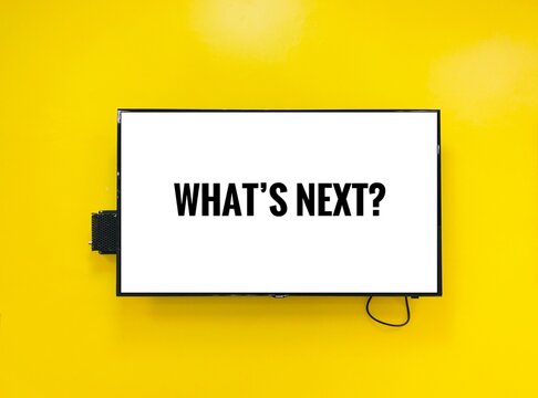 What's Next - Text In Television On Yellow Background