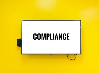 compliance - text in Television on yellow background