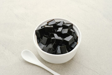 Cincau or Grass jelly (Mesona chinensis). It's Southeast Asia Dessert. Familiar during the month of Ramadan in Indonesia. 
