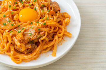 stir-fried udon noodles with kimchi and pork