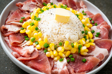fresh pork raw sliced with rice and corn on plate and ready to cook