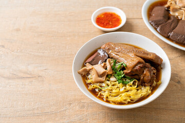 egg noodles with stewed and braised duck in brown soup