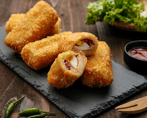 Risol Mayo, Risoles mayo with mozzarella filling, a small patty enclosed in pastry or rolled in bread crumbs. it is filled with smoked beef, mayonnaise, boiled egg and mozzarella cheese. 