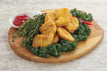 Crispy chicken nuggets with tomato ketchup