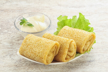 Stuffed pancakes with meat and cream