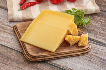 Parmesan hard cheese with small pieces