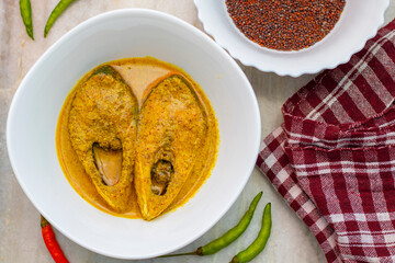Famous Bengali Dish Hilsa/Ilish fish with poppy and mustard seed recipe.
