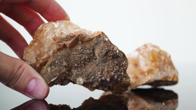 Wild Druse from the bottom of the sea. Natural precious raw citrine on the table. Banner concept about natural stones. Large. 4k. natural stone in hand. show druza in hand